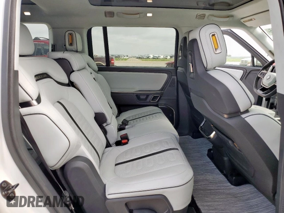 2023 Rivian R1S Adventure z VIN 7PDSGABA4PN026056, wystawiony jako Copart lot #56892495 z przebiegiem Nie podano mil oraz Szkoda całkowita • Salvage title. Historia ofert i sprzedaży dostępna na DreamBid. Obrazek 11.