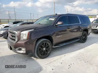 2015 GMC Yukon XL SLT z VIN 1GKS1HKC4FR183570, wystawiony jako Copart lot #59983705 z przebiegiem 206 505 mil mil oraz Czysty tytuł • Clean title. Historia ofert i sprzedaży dostępna na DreamBid. Obrazek 1.
