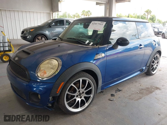 2007 MINI Hardtop S with VIN WMWMF73557TT86128, listed as a IAAI auction lot 42417311 with 114,911 mi miles and . Bid and sale history available at DreamBid. Image 2.