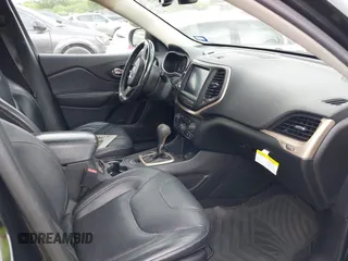 2014 Jeep Cherokee Limited with VIN 1C4PJLDS8EW104085, listed as a IAAI auction lot 42104059 with 141,951 mi miles and . Bid and sale history available at DreamBid. Image 5.