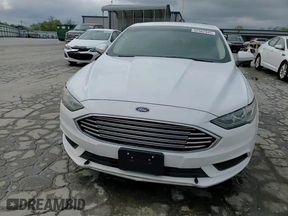 2018 Ford Fusion SE z VIN 3FA6P0LU2JR234975, wystawiony jako Copart lot #52562945 z przebiegiem 148 801 mil mil oraz Szkoda całkowita • Salvage title. Historia ofert i sprzedaży dostępna na DreamBid. Obrazek 14.