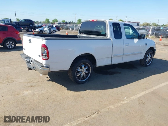 2000 Ford F-150 XL with VIN 1FTRX17LXYKA19714, listed as a IAAI auction lot 41996370 with 0 mi miles. Bid and sale history available at carsss.com. Image 4.