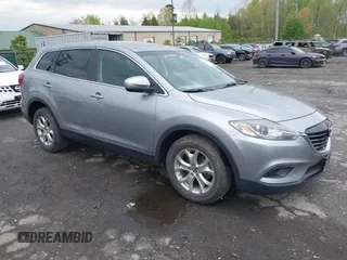 2015 Mazda CX-9 Sport with VIN JM3TB3BV2F0454770, listed as a IAAI auction lot 42009879 with 98,916 mi miles. Bid and sale history available at carsss.com. Image 1.
