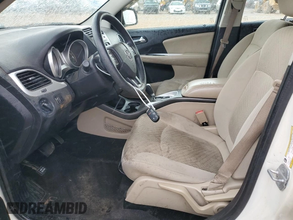 2013 Dodge Journey American Value with VIN 3C4PDCAB5DT656997, listed as a Copart auction lot 57123565 with 201,799 mi miles and Salvage title. Bid and sale history available at DreamBid. Image 7.