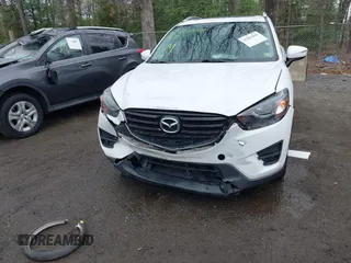 2016 Mazda CX-5 Grand Touring with VIN JM3KE4DY3G0838204, listed as a IAAI auction lot 41961049 with 98,918 mi miles and . Bid and sale history available at carsss.com. Image 6.