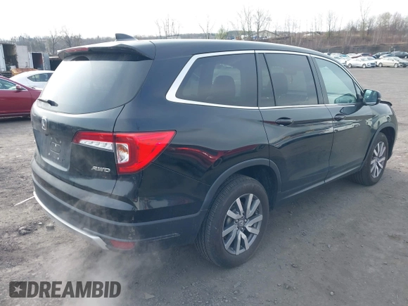 2021 Honda Pilot EX-L with VIN 5FNYF6H56MB099919, listed as a IAAI auction lot 42000420 with 28,877 mi miles and . Bid and sale history available at carsss.com. Image 4.