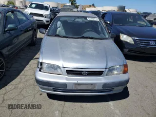 1995 Toyota Tercel DX z VIN JT2EL56E7S7011335, wystawiony jako Copart lot #67978774 z przebiegiem 182 025 mil mil oraz Szkoda całkowita • Salvage title. Historia ofert i sprzedaży dostępna na DreamBid. Obrazek 5.