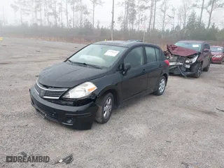 2009 Nissan Versa 1.8 S with VIN 3N1BC13E99L423269, listed as a IAAI auction lot 41490644 with 124,241 mi miles. Bid and sale history available at carsss.com. Image 2.