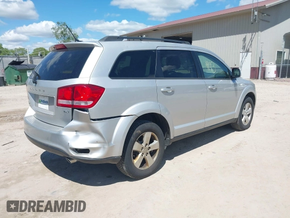 2012 Dodge Journey SXT z VIN 3C4PDCBGXCT390031, wystawiony jako IAAI lot #42281143 z przebiegiem 130 213 mil mil oraz . Historia ofert i sprzedaży dostępna na DreamBid. Obrazek 4.