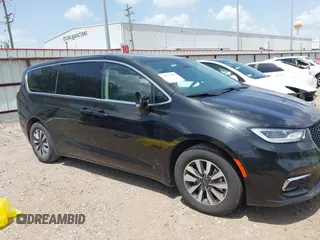 2023 Chrysler Pacifica Hybrid Touring L with VIN 2C4RC1L70PR622000, listed as a IAAI auction lot 42711826 with 65,109 mi miles and . Bid and sale history available at DreamBid. Image 14.