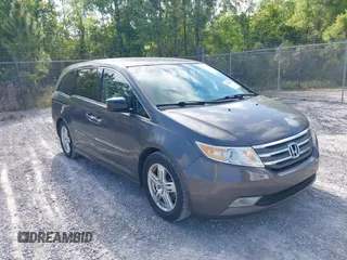 2012 Honda Odyssey Touring с VIN 5FNRL5H93CB133288, выставлен на аукционе IAAI как лот 42020622 с пробегом 184 077 миль миль и . История ставок и продаж доступна на DreamBid. Изображение 1.