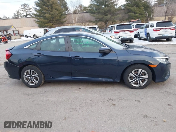 2017 Honda Civic LX z VIN 19XFC2F52HE028823, wystawiony jako IAAI lot #41312009 z przebiegiem 56 462 mil mil oraz . Historia ofert i sprzedaży dostępna na DreamBid. Obrazek 13.