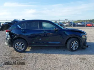 2023 Mazda CX-5 2.5 S Select Package with VIN JM3KFBBM1P0284887, listed as a IAAI auction lot 41910092 with 2,616 mi miles. Bid and sale history available at carsss.com. Image 13.