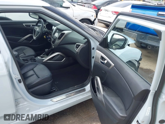 2015 Hyundai Veloster z VIN KMHTC6AD8FU222744, wystawiony jako IAAI lot #42129397 z przebiegiem Nie podano mil oraz . Historia ofert i sprzedaży dostępna na DreamBid. Obrazek 5.