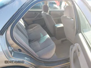 1998 Toyota Camry LE z VIN 4T1BF28K4WU051992, wystawiony jako IAAI lot #41426638 z przebiegiem 166 763 mil mil oraz . Historia ofert i sprzedaży dostępna na DreamBid. Obrazek 8.