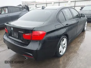 2014 BMW 3 Series 335i with VIN WBA3A9C57EF477662, listed as a IAAI auction lot 41435544 with 129,543 mi miles. Bid and sale history available at carsss.com. Image 4.
