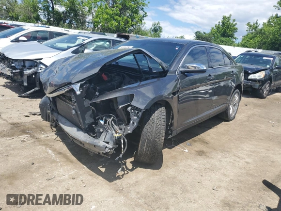 2015 Ford Taurus Limited z VIN 1FAHP2F87FG170997, wystawiony jako Copart lot #54346554 z przebiegiem Nie podano mil oraz Szkoda całkowita • Salvage title. Historia ofert i sprzedaży dostępna na DreamBid. Obrazek 1.