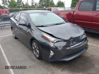 2016 Toyota Prius Four z VIN JTDKARFU9G3007283, wystawiony jako IAAI lot #42333828 z przebiegiem 116 498 mil mil oraz . Historia ofert i sprzedaży dostępna na DreamBid. Obrazek 1.