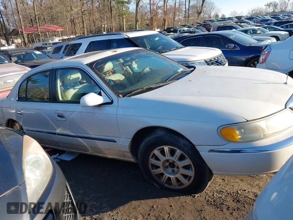 2001 Lincoln Continental with VIN 1LNHM97V71Y670611, listed as a IAAI auction lot 41385621 with 141,714 mi miles. Bid and sale history available at carsss.com. Image 1.