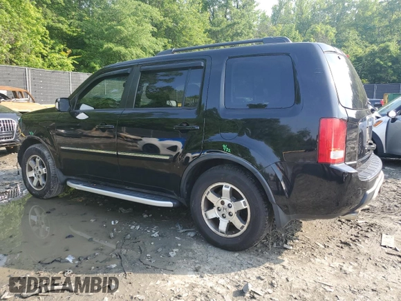 2011 Honda Pilot Touring z VIN 5FNYF4H92BB090512, wystawiony jako Copart lot #57046015 z przebiegiem 159 814 mil mil oraz Szkoda całkowita • Salvage title. Historia ofert i sprzedaży dostępna na DreamBid. Obrazek 2.