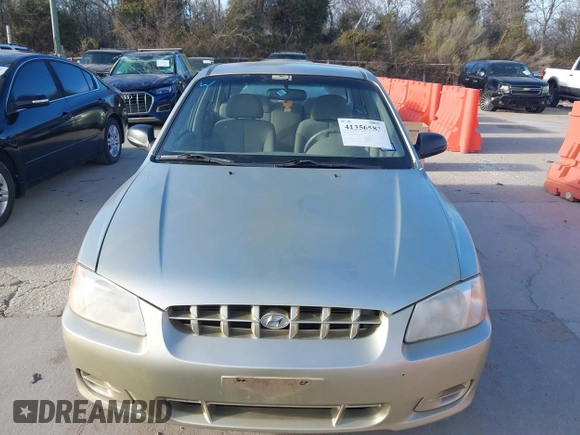 2000 Hyundai Accent z VIN KMHCG45G3YU034438, wystawiony jako IAAI lot #41356583 z przebiegiem 57 283 mil mil oraz . Historia ofert i sprzedaży dostępna na DreamBid. Obrazek 6.