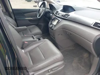 2014 Honda Odyssey Touring with VIN 5FNRL5H9XEB045695, listed as a IAAI auction lot 41545348 with 131,472 mi miles and . Bid and sale history available at carsss.com. Image 5.