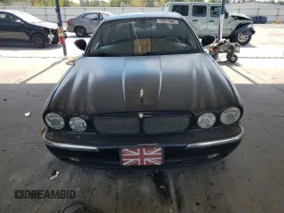 2004 Jaguar XJ с VIN SAJEA73B24TG10774, выставлен на аукционе Copart как лот 72577604 с пробегом 217 846 миль миль и Чистый • Clean title. История ставок и продаж доступна на DreamBid. Изображение 5.