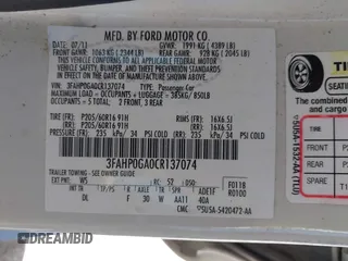 2012 Ford Fusion S with VIN 3FAHP0GA0CR137074, listed as a IAAI auction lot 41756162 with 165,205 mi miles. Bid and sale history available at carsss.com. Image 9.