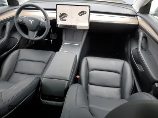 2023 Tesla Model 3 with VIN 5YJ3E1EA3PF697049, listed as a Copart auction lot 55601295 with 12,373 mi miles and Salvage Title. Bid and sale history available at DreamBid. Image 8.