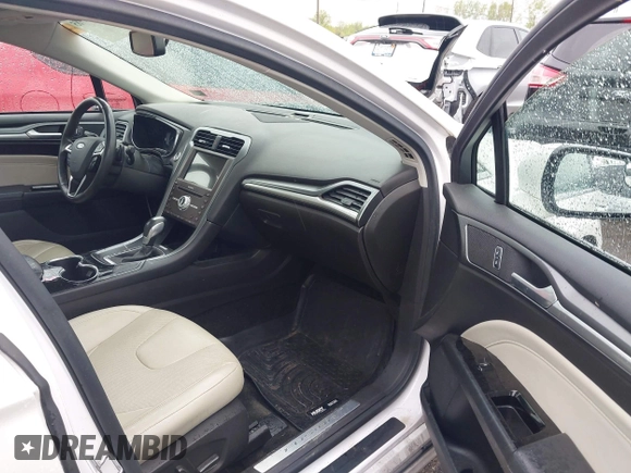 2016 Ford Fusion Titanium with VIN 3FA6P0K98GR369433, listed as a IAAI auction lot 42214785 with 64,918 mi miles and . Bid and sale history available at DreamBid. Image 5.