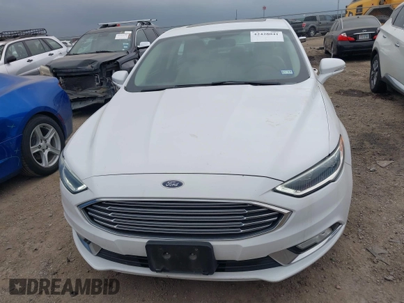 2017 Ford Fusion Titanium z VIN 3FA6P0K96HR124146, wystawiony jako IAAI lot #42428041 z przebiegiem 204 306 mil mil oraz . Historia ofert i sprzedaży dostępna na DreamBid. Obrazek 12.