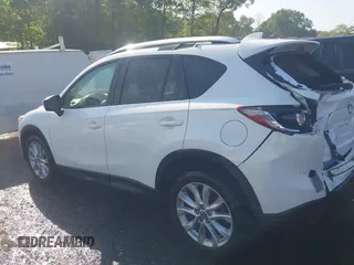 2014 Mazda CX-5 Grand Touring with VIN JM3KE2DY1E0424890, listed as a IAAI auction lot 42052437 with 107,793 mi miles. Bid and sale history available at carsss.com. Image 14.