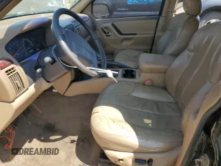 2000 Jeep Grand Cherokee Laredo z VIN 1J4GW48N0YC210235, wystawiony jako Copart lot #60558905 z przebiegiem 131 108 mil mil oraz Szkoda całkowita • Salvage title. Historia ofert i sprzedaży dostępna na DreamBid. Obrazek 7.