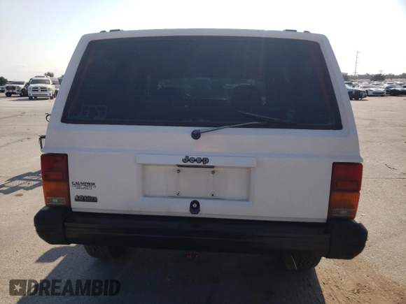 1996 Jeep Cherokee SE with VIN 1J4FT28S3TL197827, listed as a Copart auction lot 75443574 with 116,660 mi miles and Salvage Title. Bid and sale history available at carsss.com. Image 6.