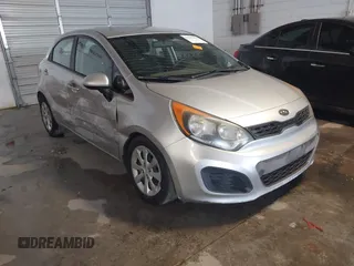 2012 Kia Rio LX with VIN KNADM5A39C6038580, listed as a IAAI auction lot 41297070 with 140,720 mi miles. Bid and sale history available at carsss.com. Image 1.