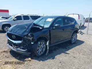 2020 Mazda CX-5 Grand Touring with VIN JM3KFADM9L1837183, listed as a IAAI auction lot 42340628 with 81,975 mi miles and . Bid and sale history available at DreamBid. Image 19.