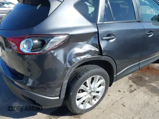 2014 Mazda CX-5 Grand Touring with VIN JM3KE4DY4E0320695, listed as a IAAI auction lot 41989350 with 169,391 mi miles and . Bid and sale history available at DreamBid. Image 12.