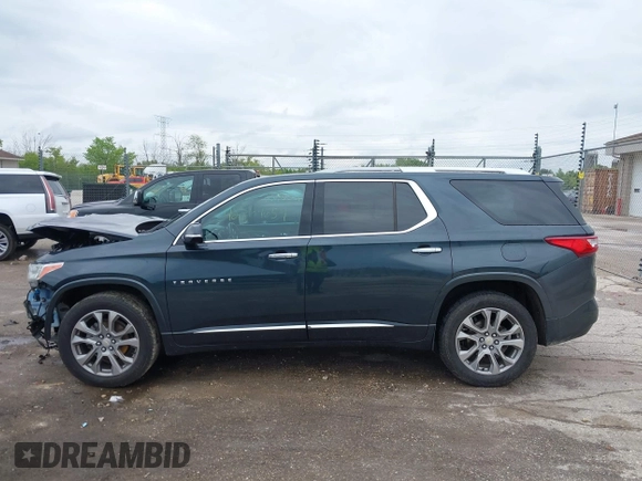 2018 Chevrolet Traverse Premier z VIN 1GNEVJKW4JJ240024, wystawiony jako IAAI lot #42369659 z przebiegiem 160 147 mil mil oraz . Historia ofert i sprzedaży dostępna na DreamBid. Obrazek 15.