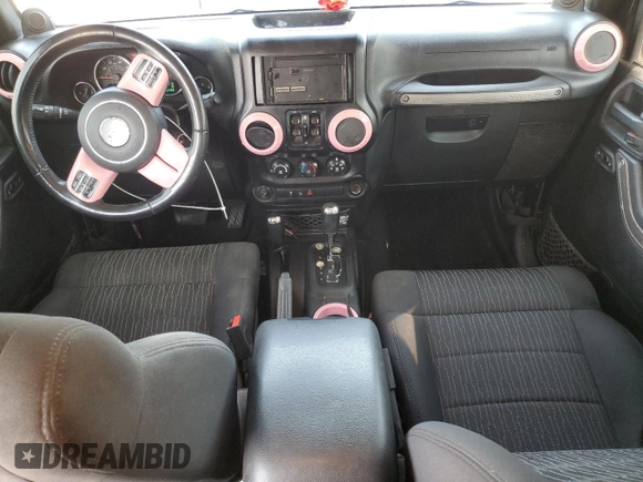 2012 Jeep Wrangler Unlimited Sport with VIN 1C4BJWDG8CL116811, listed as a Copart auction lot 59372085 with 95,498 mi miles and Salvage title. Bid and sale history available at DreamBid. Image 8.
