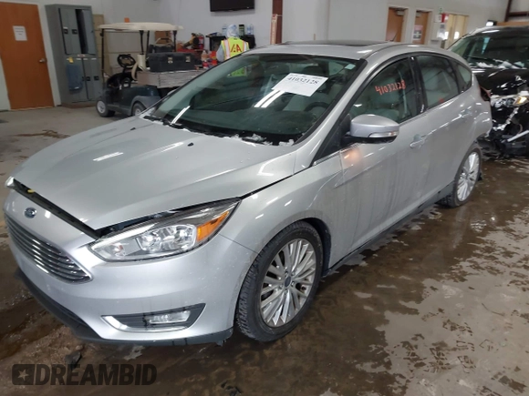 2018 Ford Focus Titanium with VIN 1FADP3N25JL261736, listed as a IAAI auction lot 41032128 with 59,142 mi miles and . Bid and sale history available at DreamBid. Image 2.