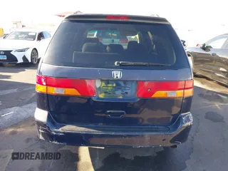 2004 Honda Odyssey EX z VIN 5FNRL18614B080980, wystawiony jako IAAI lot #41940014 z przebiegiem 233 465 mil mil oraz . Historia ofert i sprzedaży dostępna na DreamBid. Obrazek 14.