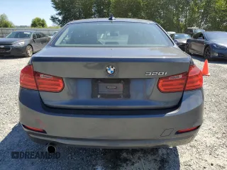 2014 BMW 3 Series 320i with VIN WBA3B1C54EK132952, listed as a Copart auction lot 63653435 with 63,260 mi miles and Salvage title. Bid and sale history available at DreamBid. Image 6.