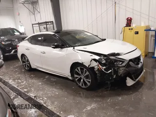 2016 Nissan Maxima Platinum z VIN 1N4AA6AP8GC391395, wystawiony jako IAAI lot #41351726 z przebiegiem 184 756 mil mil oraz . Historia ofert i sprzedaży dostępna na DreamBid. Obrazek 1.
