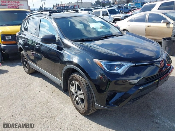 2018 Toyota RAV4 LE with VIN 2T3ZFREVXJW457751, listed as a IAAI auction lot 41529251 with 230,054 mi miles. Bid and sale history available at carsss.com. Image 1.