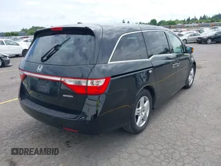 2012 Honda Odyssey Touring with VIN 5FNRL5H93CB121190, listed as a IAAI auction lot 42223998 with 154,358 mi miles and . Bid and sale history available at DreamBid. Image 4.
