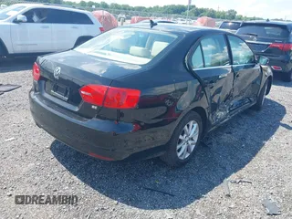 2014 Volkswagen Jetta SE with VIN 3VWD17AJ4EM429576, listed as a IAAI auction lot 42542604 with 142,313 mi miles and . Bid and sale history available at DreamBid. Image 4.