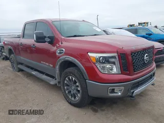 2017 Nissan Titan XD PRO-4X with VIN 1N6BA1F44HN546415, listed as a IAAI auction lot 41275619 with 121,062 mi miles. Bid and sale history available at carsss.com. Image 1.
