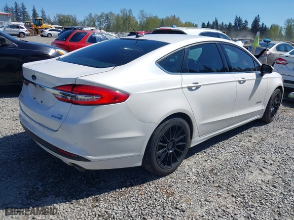 2018 Ford Fusion Hybrid SE with VIN 3FA6P0LU3JR226934, listed as a IAAI auction lot 42063065 with 126,683 mi miles. Bid and sale history available at carsss.com. Image 4.