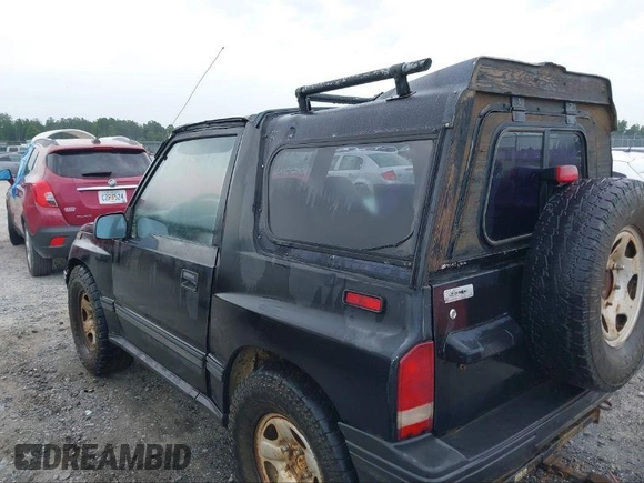 1995 Geo Tracker z VIN 2CNBE18U0S6943292, wystawiony jako IAAI lot #41274067 z przebiegiem Nie podano mil oraz . Historia ofert i sprzedaży dostępna na DreamBid. Obrazek 3.