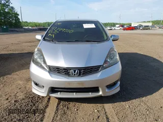 2013 Honda Fit Sport z VIN JHMGE8H69DC033802, wystawiony jako IAAI lot #42149500 z przebiegiem 144 980 mil mil oraz . Historia ofert i sprzedaży dostępna na DreamBid. Obrazek 12.